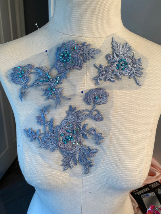 Set of blue and lavender appliqués with beads