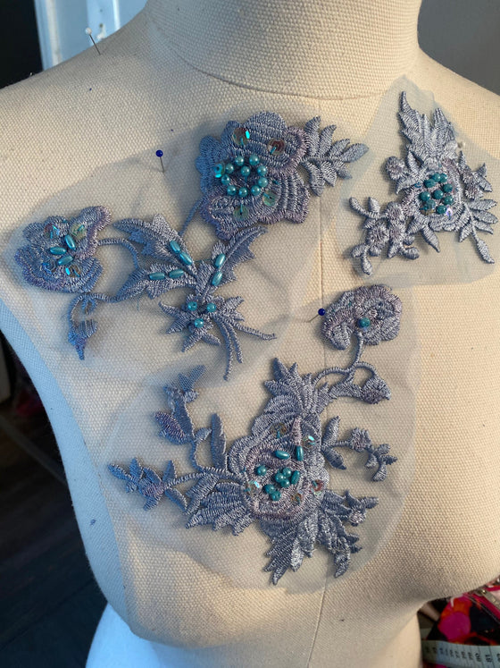 Set of blue and lavender appliqués with beads