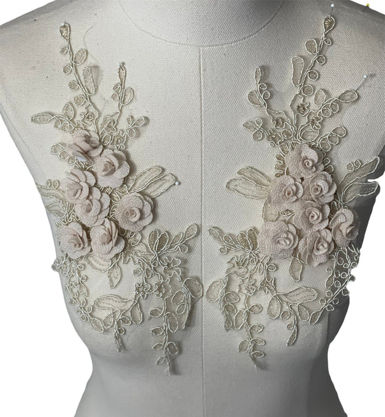 Cream colored 3D flowers appliqués with gold stitching