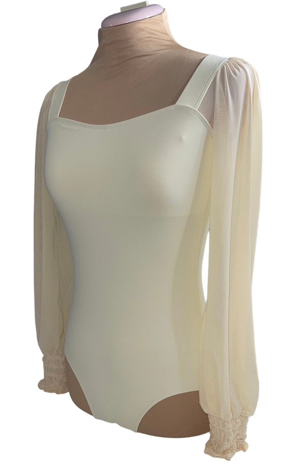 Cream Colored Leo with long mesh sleeves ruched at the wrist